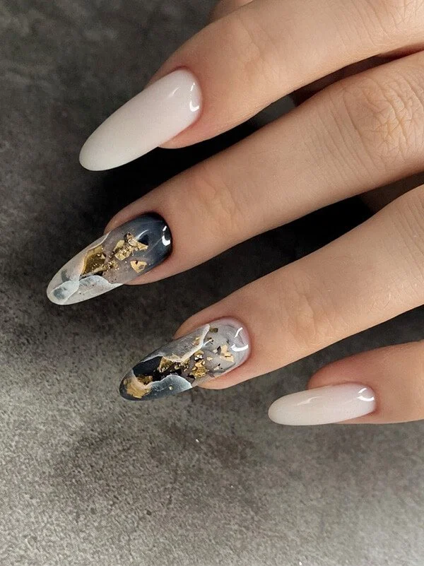 Sculpted gel nail extensions with black and gold marble design at Mars Nails NYC