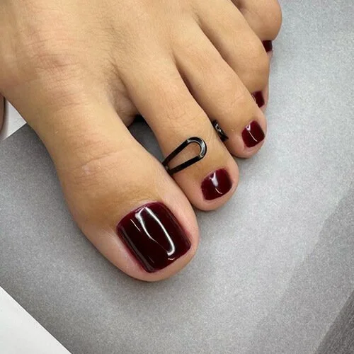 Deep red Russian gel pedicure with glossy finish at Mars Nails NYC Deep red Russian gel pedicure with glossy finish at Mars Nails NYC