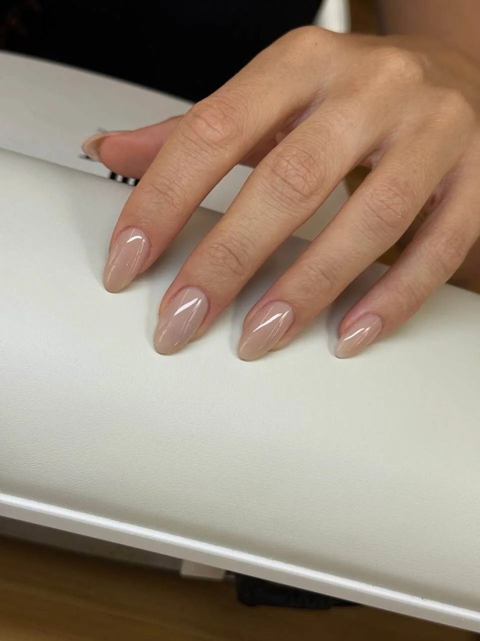 Second angle of the completed glossy nude builder gel almond manicure at Mars Nails