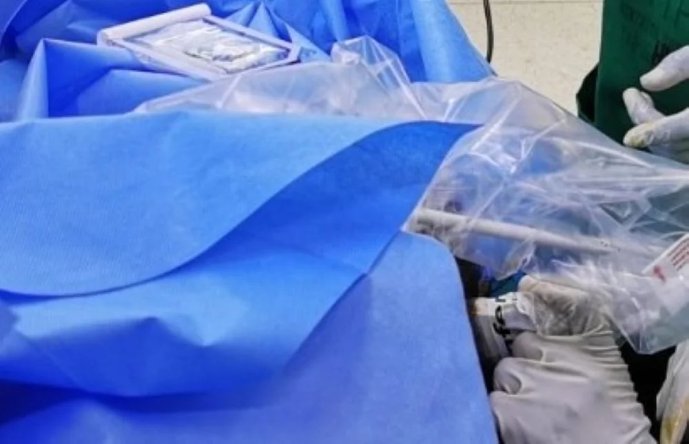 Dr. Timothy Murithi Mwiti in a clinical pain-medicine setting using ultrasound-guided techniques.