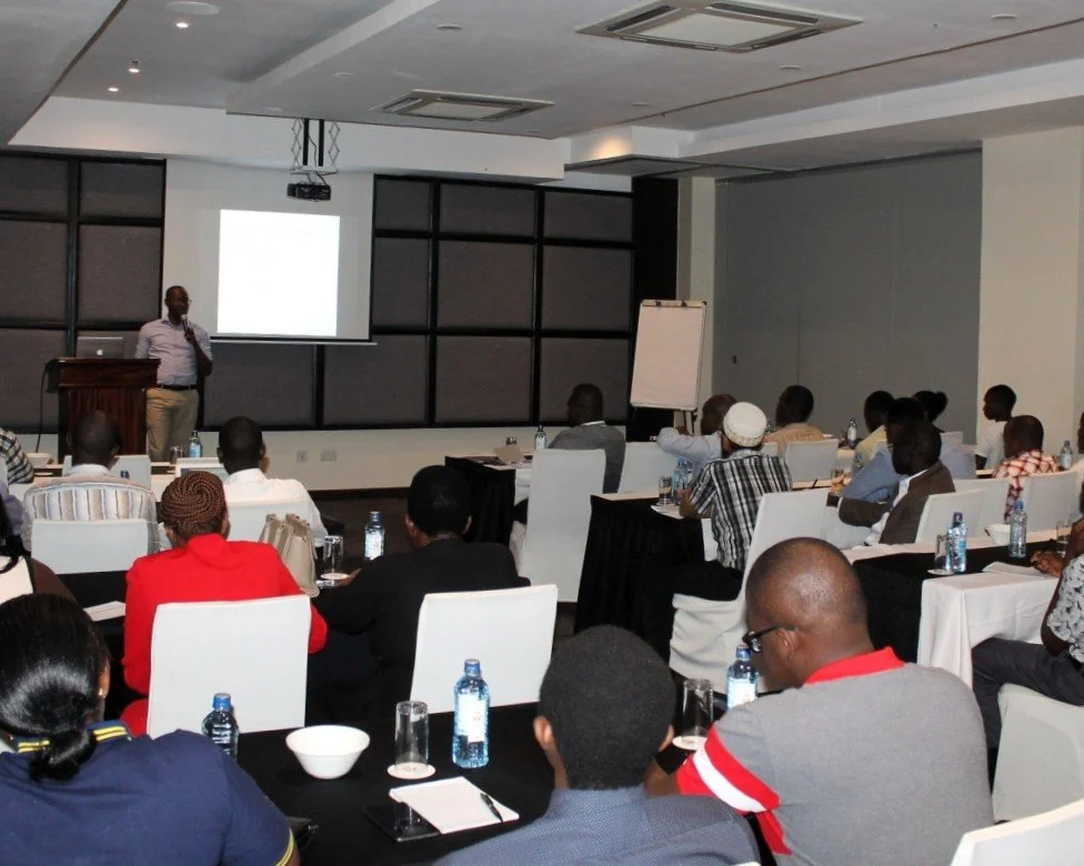 Dr. Timothy Murithi Mwiti speaking at a pain symposium in Nairobi.