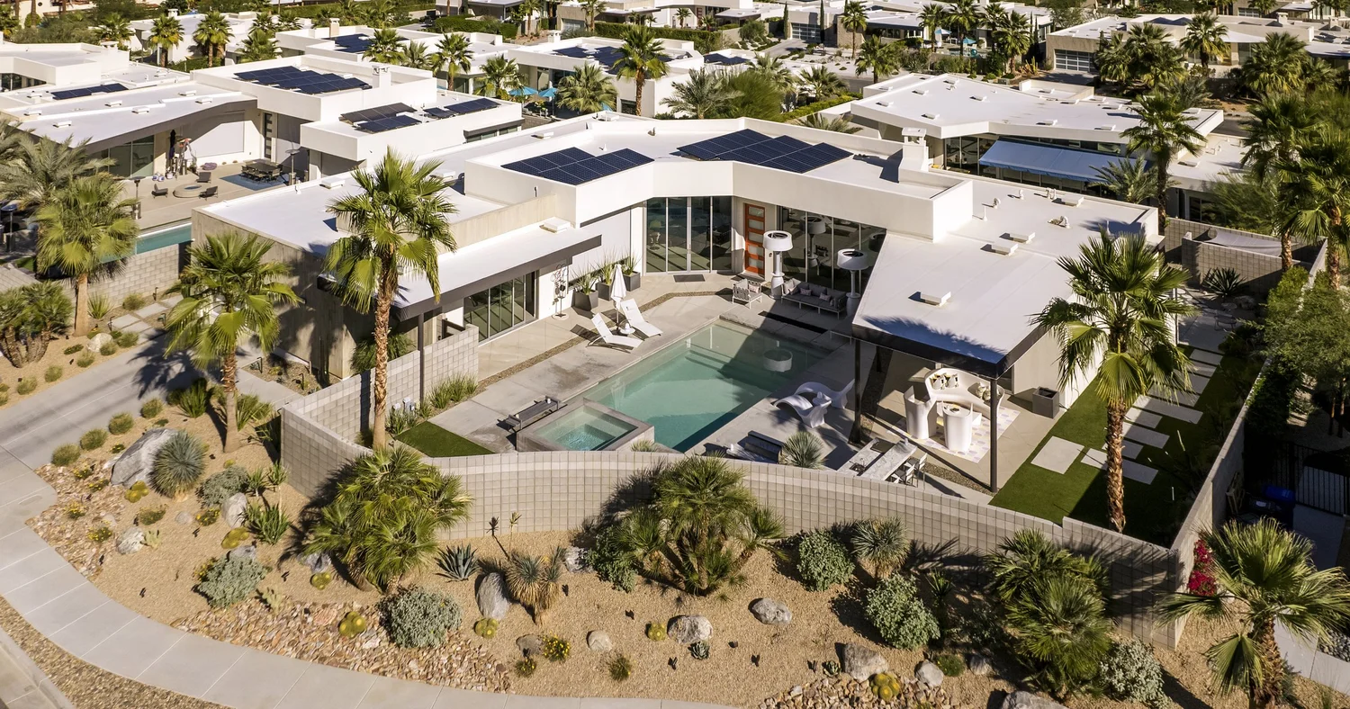 Aerial photo of a modern desert home with a pool