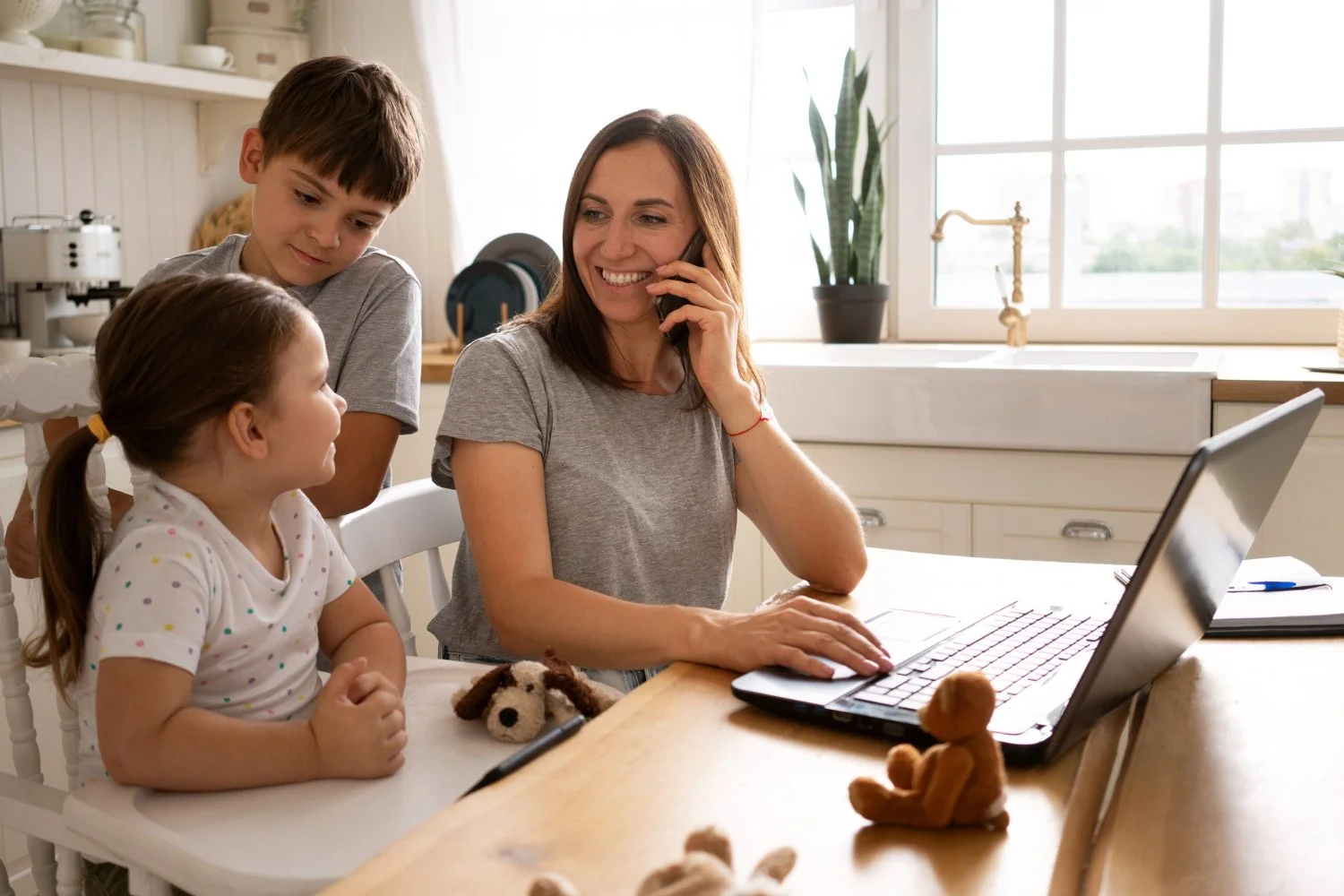 Mother working from home with child