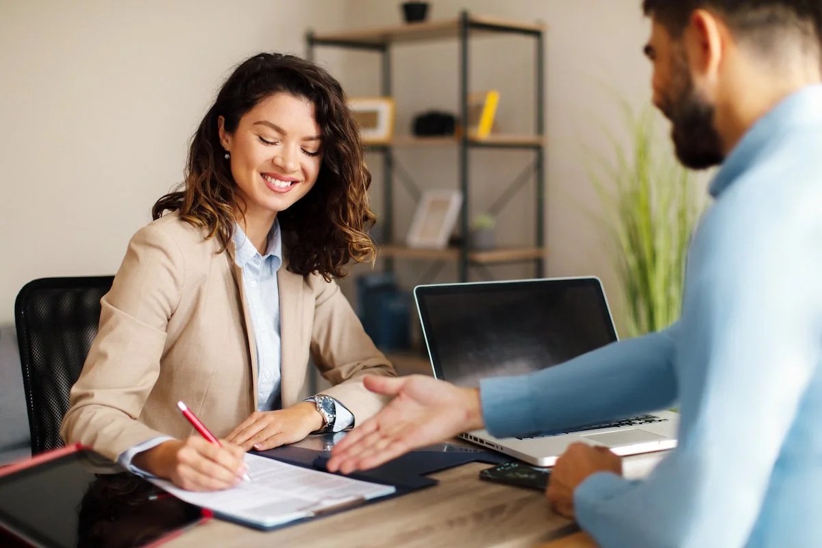 Businesswoman shaking hands with mother