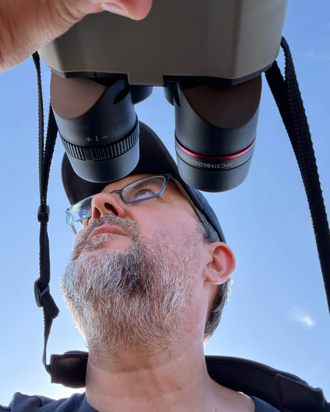 Rafael Armada birding with binoculars
