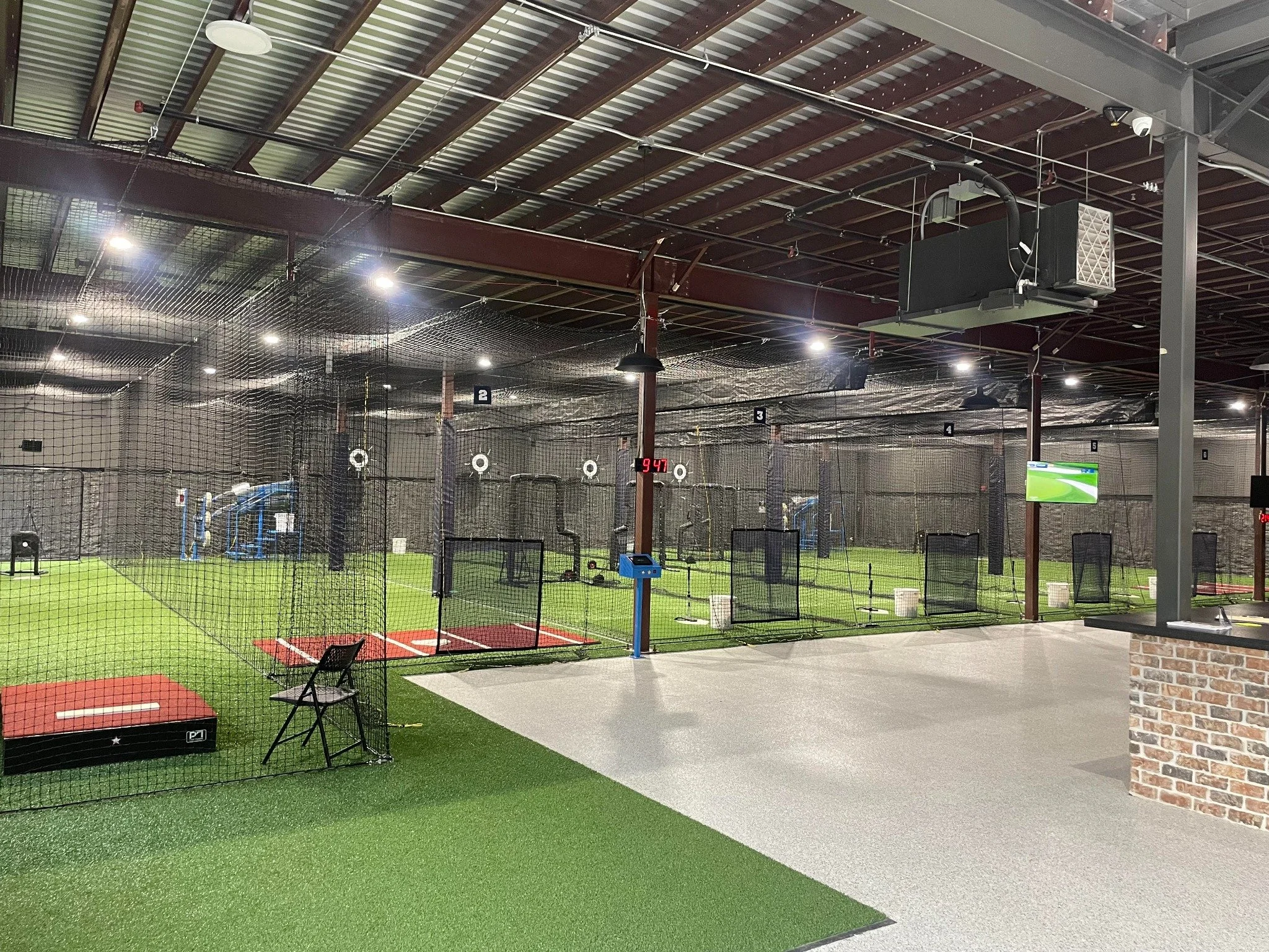 Ground-level batting and pitching cages at Lone Star Sports Zone