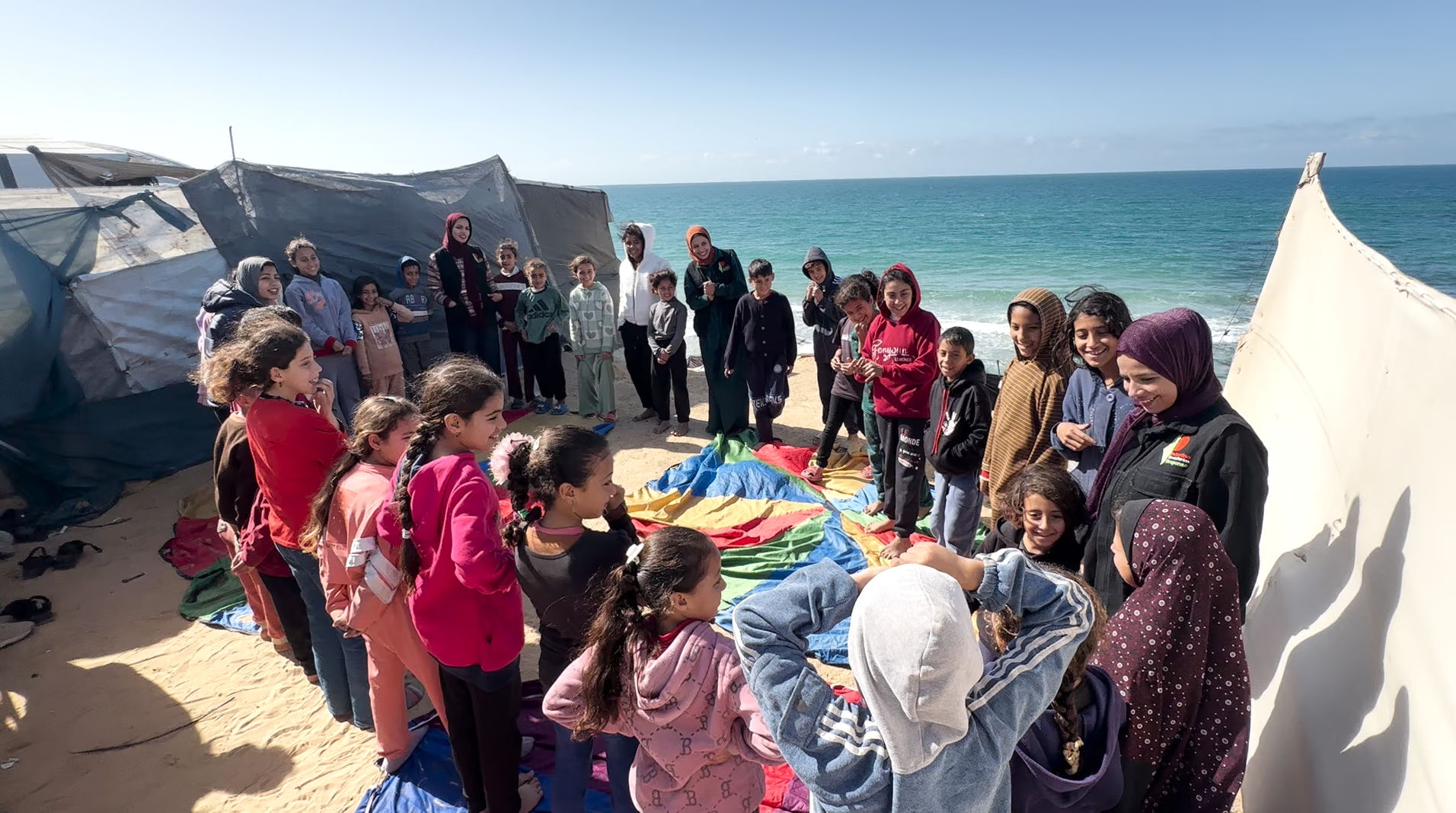 Children playing near the sea in Deir al-Balah Fixed Hub