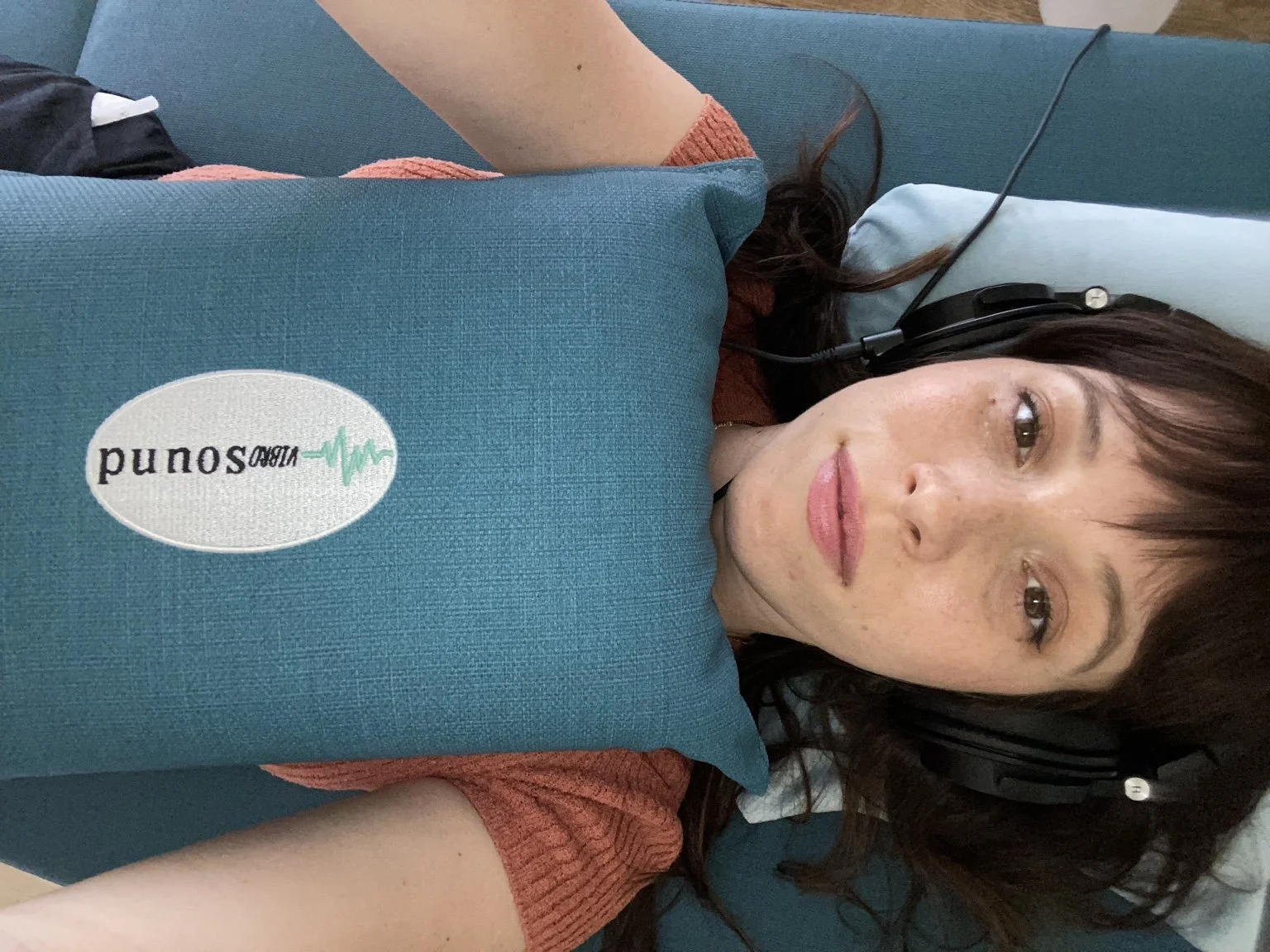 Katie resting with VibroSound equipment and headphones