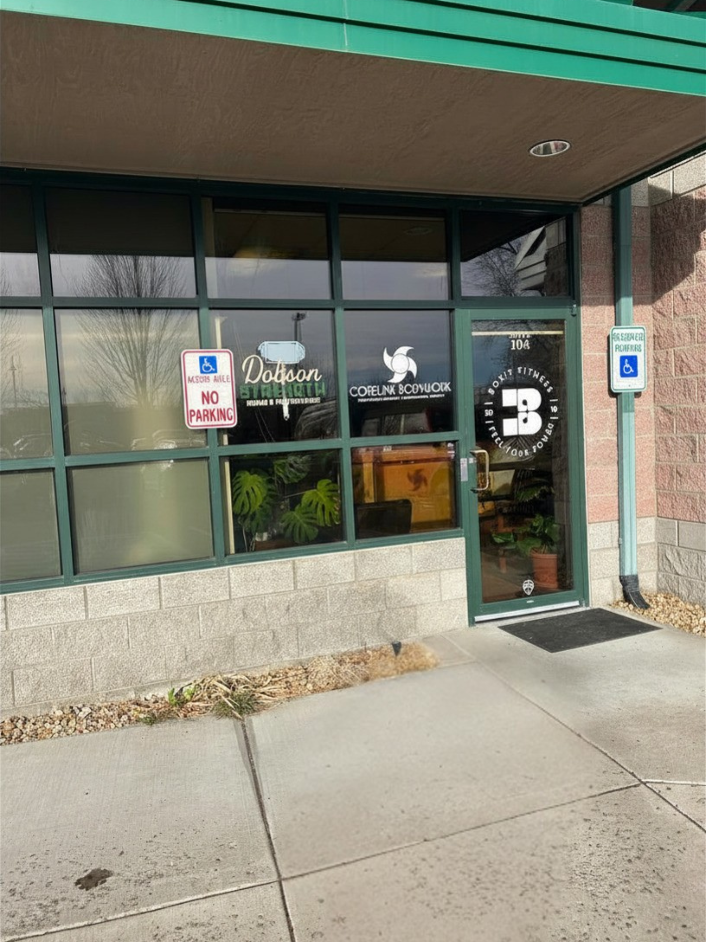 Dobson Strength office entrance with logo on frosted glass door