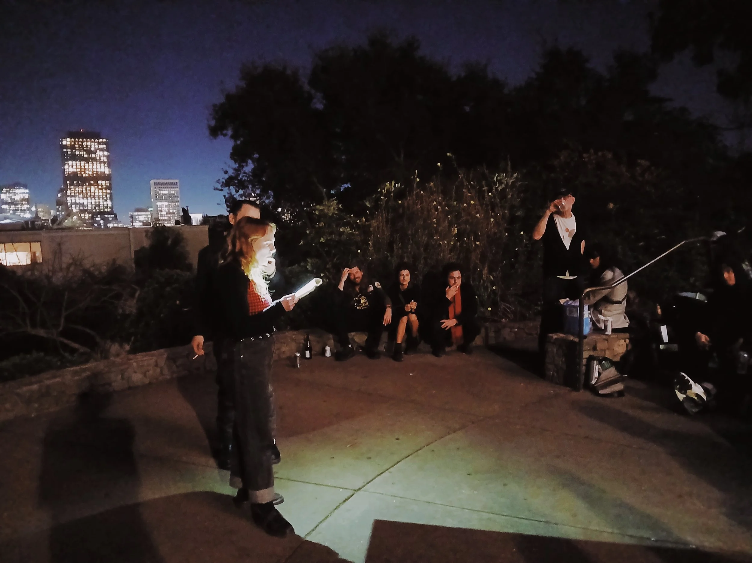 A poet reads from a Will Alexander book at Coit Tower Poetry Club