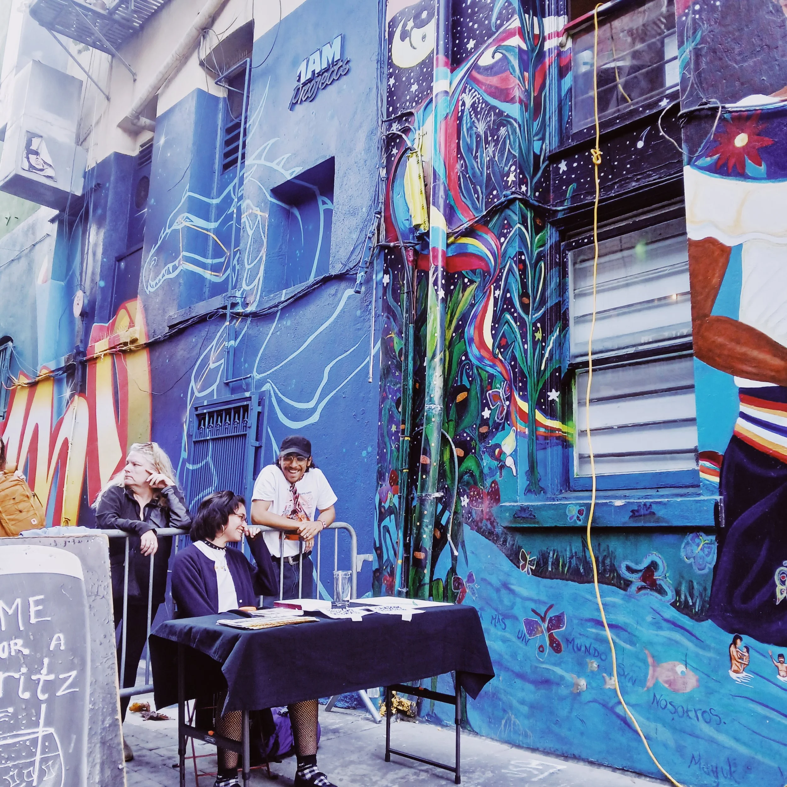 soledad con carne and Carlos Quinteros III in the alley at City Lights