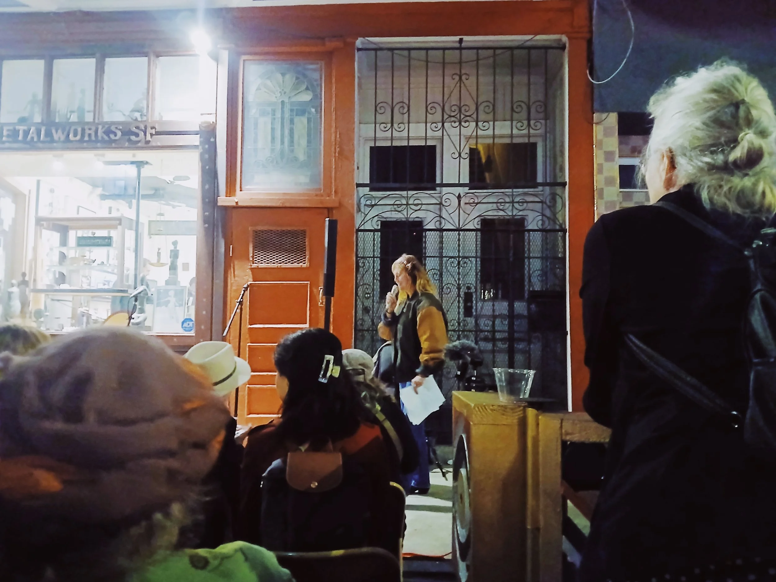 A poet reads outside of Metalworks SF