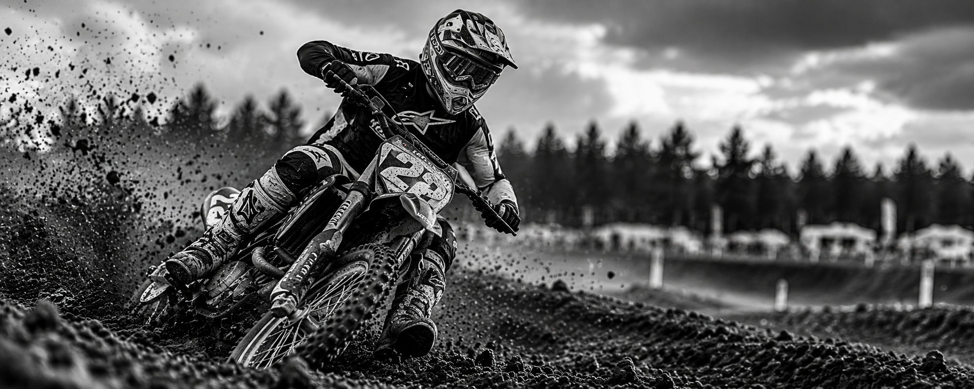 Motocross rider carving a muddy turn