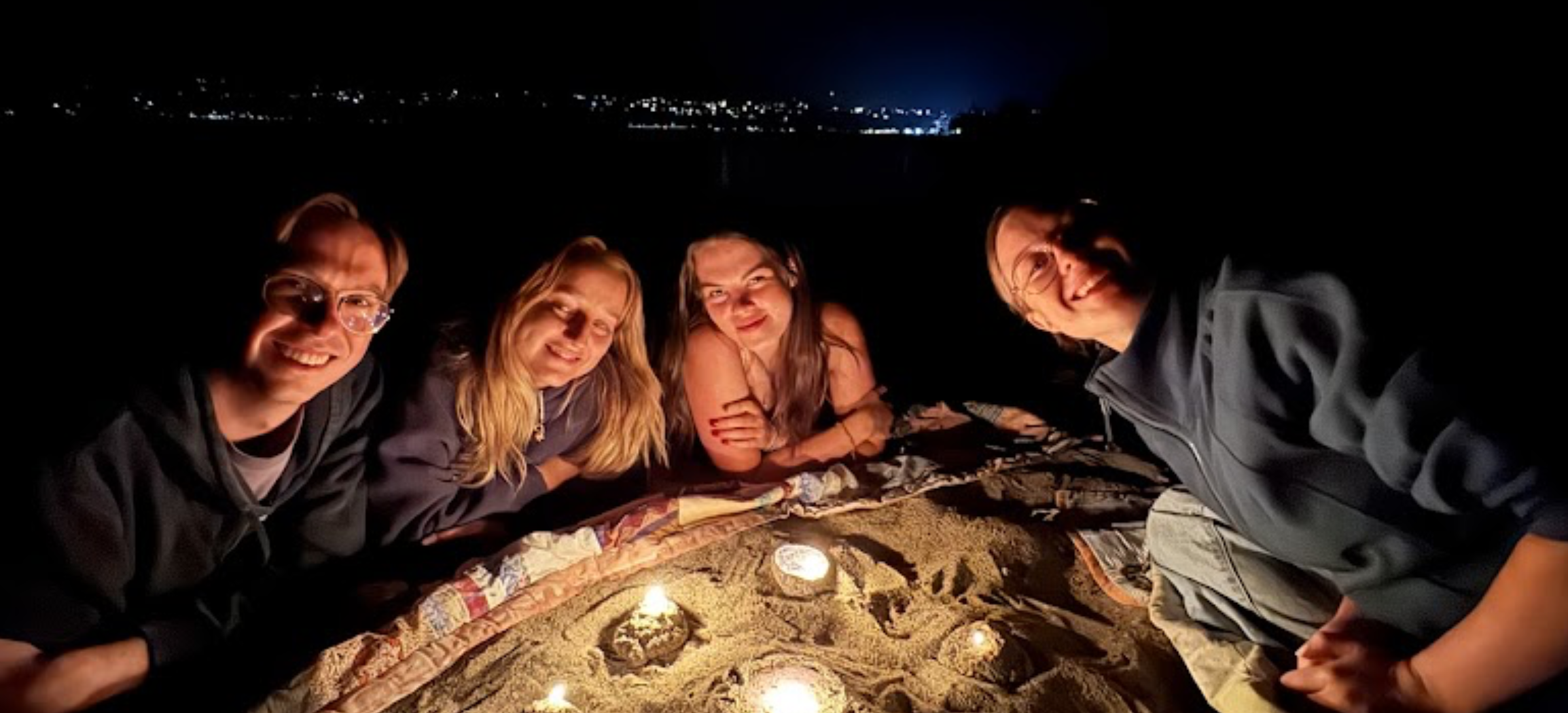 Children playing on a sand mound at Naramata Centre during Summer Sessions
