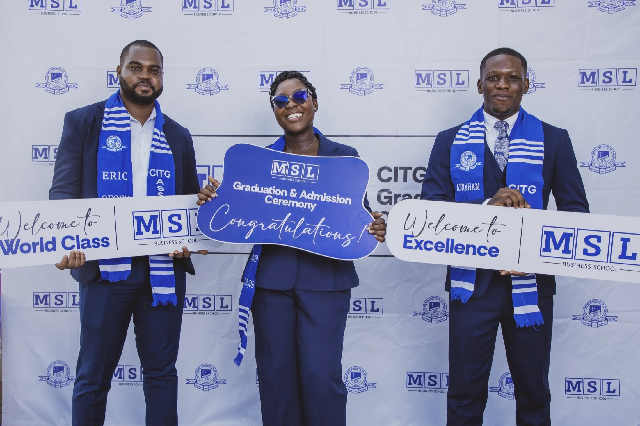 Three MSL Chartered Tax Practitioners and award winners holding MSL branded achievement placards in front of an MSL and CITG backdrop