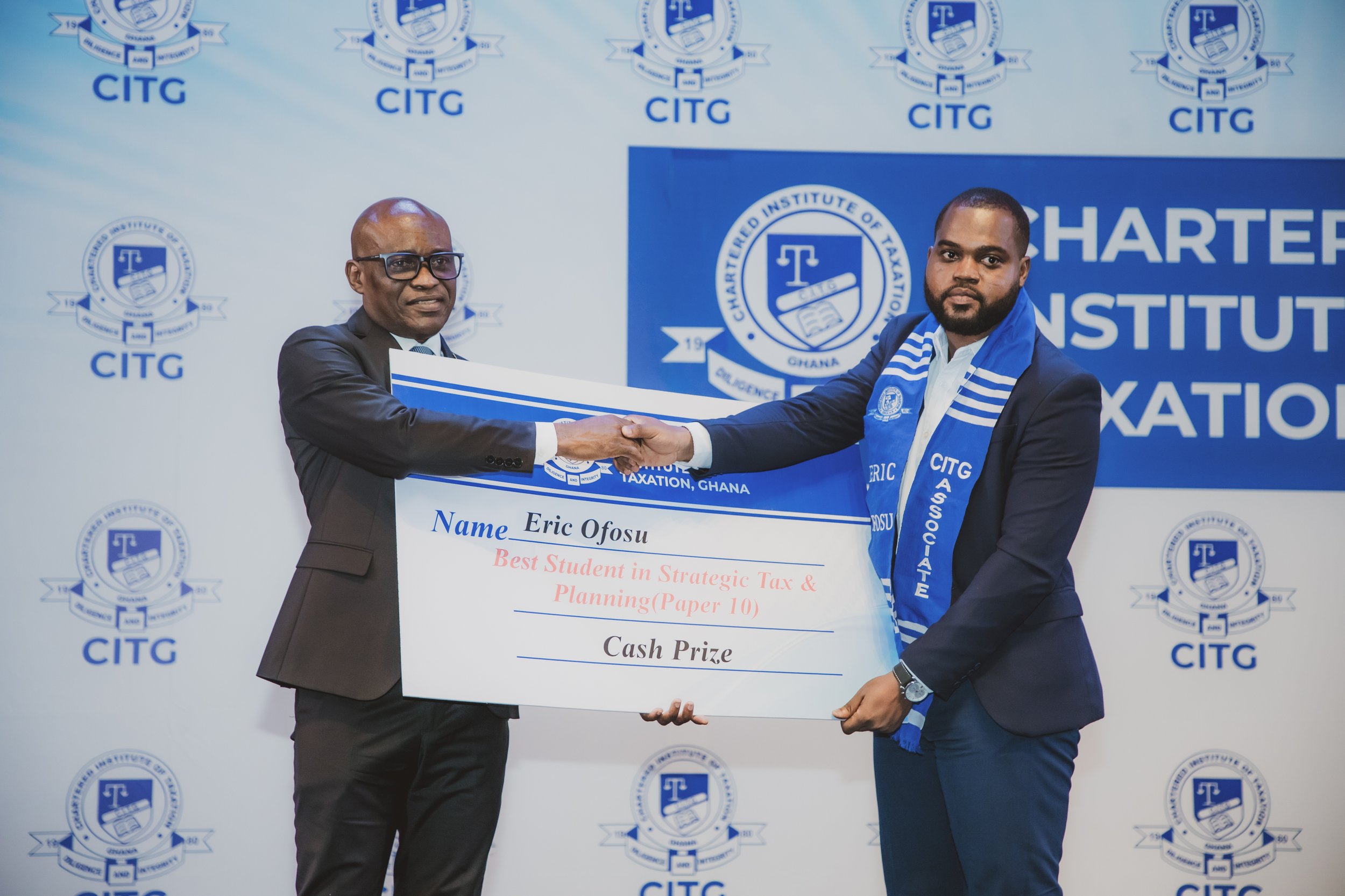 Eric Ofosu on stage receiving his Strategic Tax Planning award at the CITG Graduation Ceremony, 30 May 2026