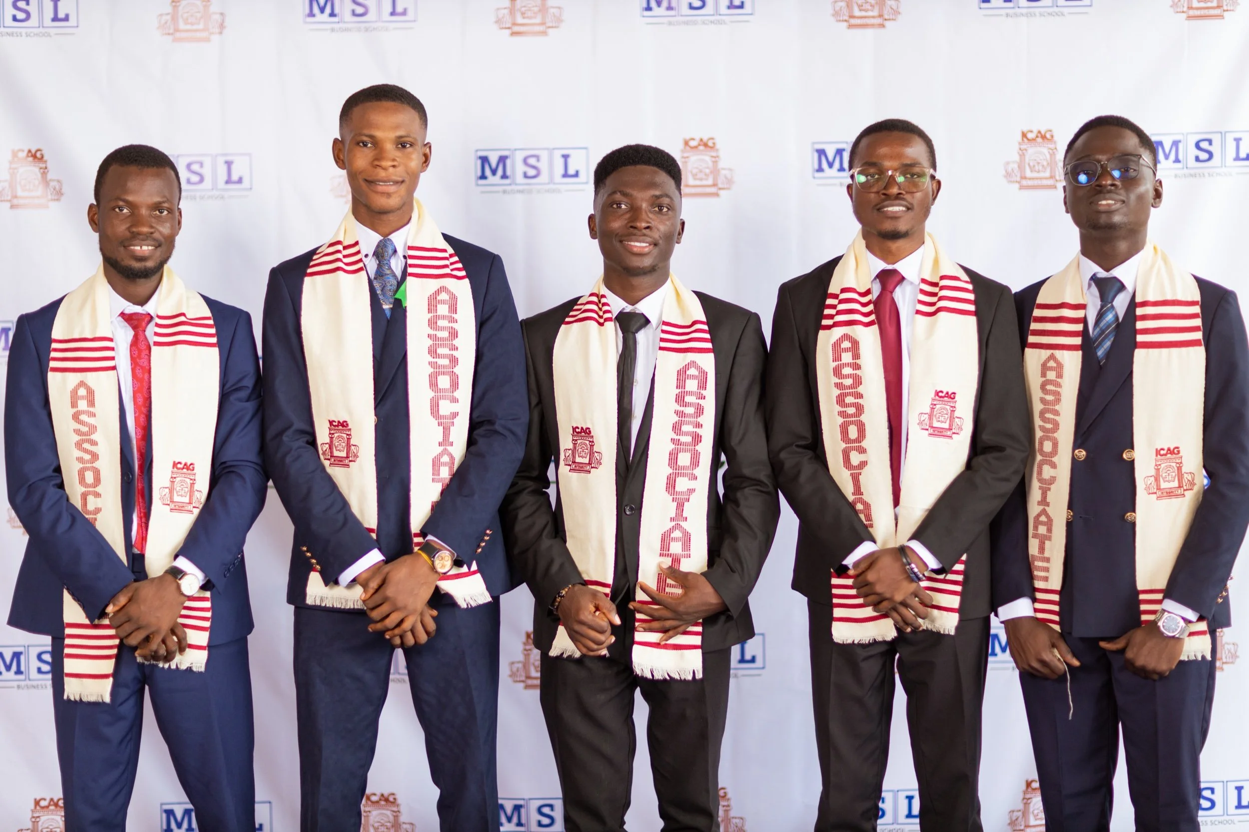 Five MSL Chartered Accountants wearing ICAG scarves in front of an MSL and ICAG backdrop