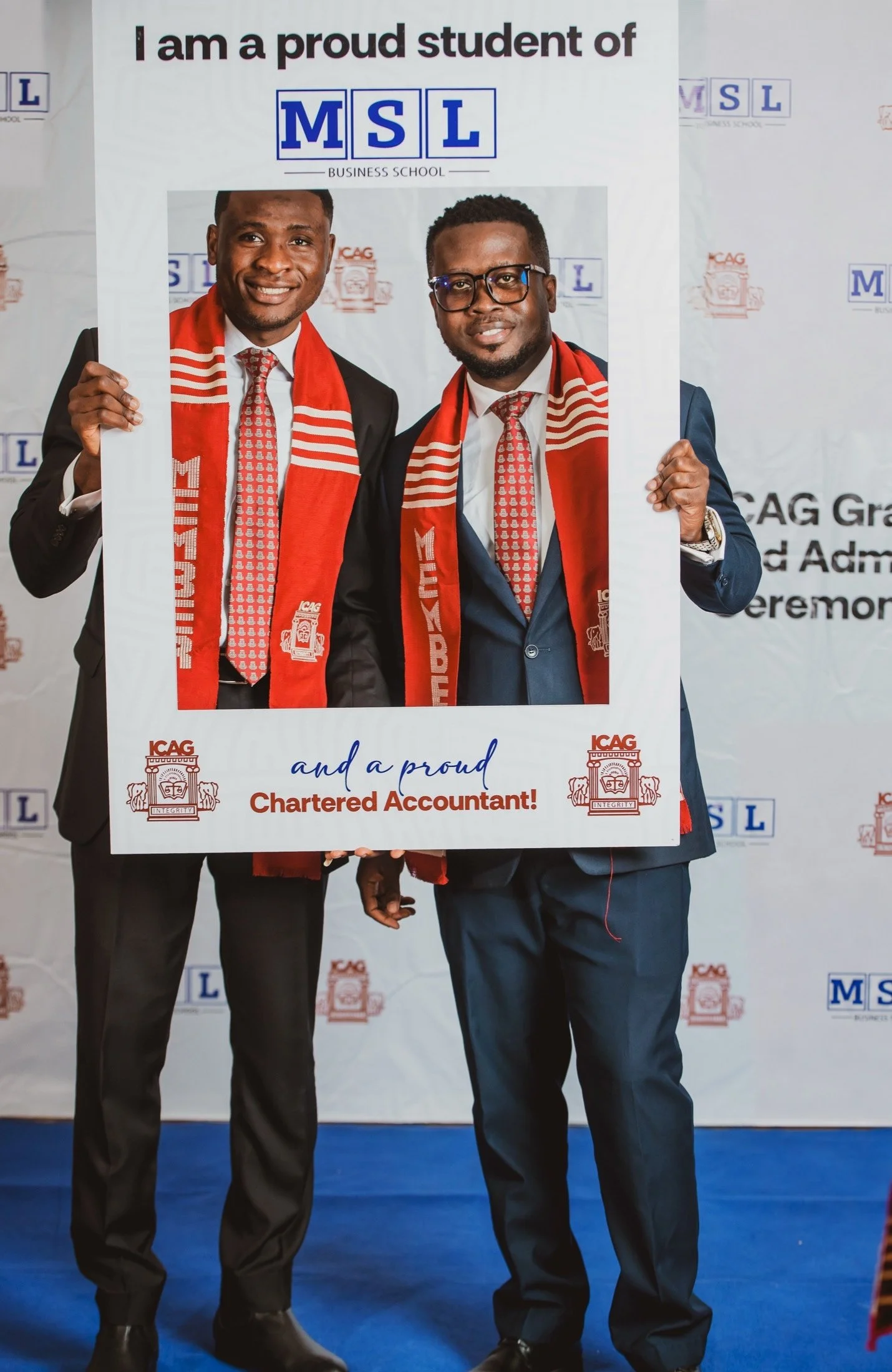 Two smiling MSL Chartered Accountants celebrating inside an MSL achievement frame