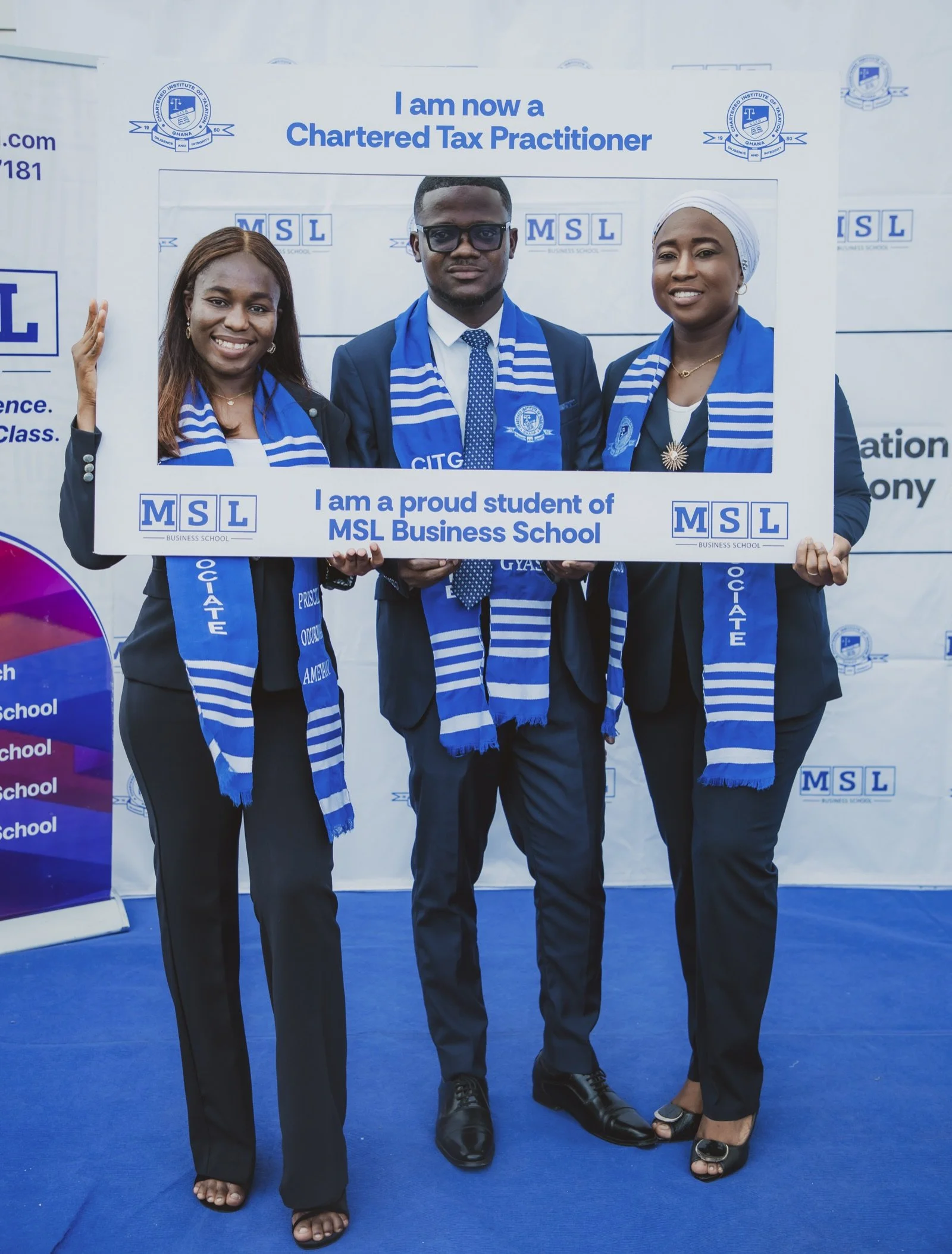 Three smiling MSL Chartered Tax Practitioners celebrating inside an MSL branded achievement frame