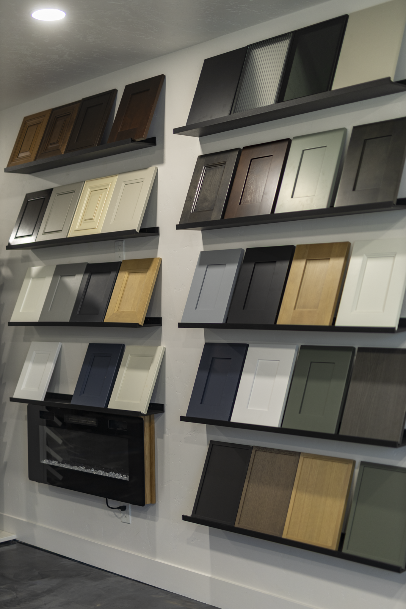 Cabinet door colors and styles displayed in the Family Man Finishes showroom