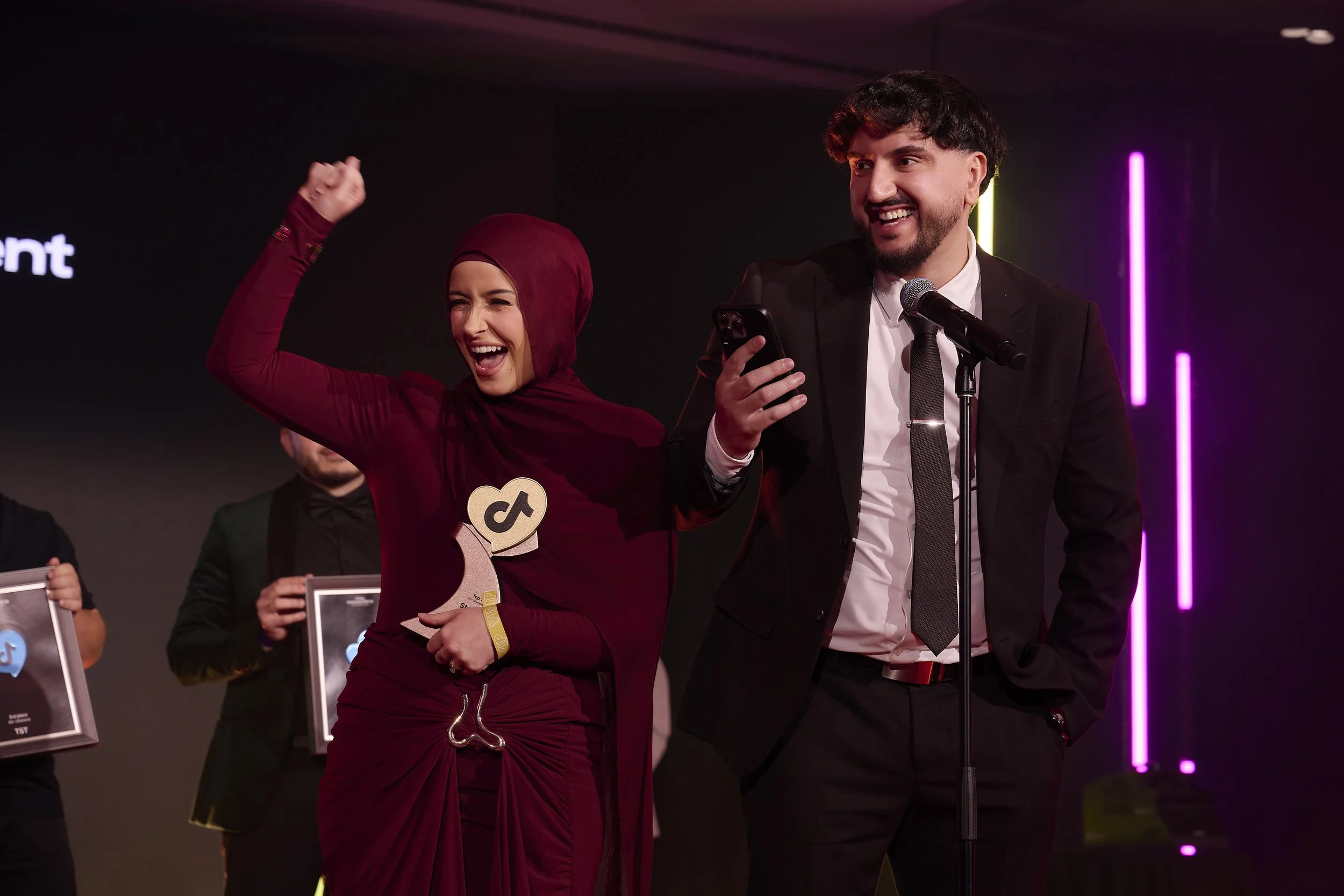Stream Chasers founders celebrating on stage at a TikTok LIVE awards night