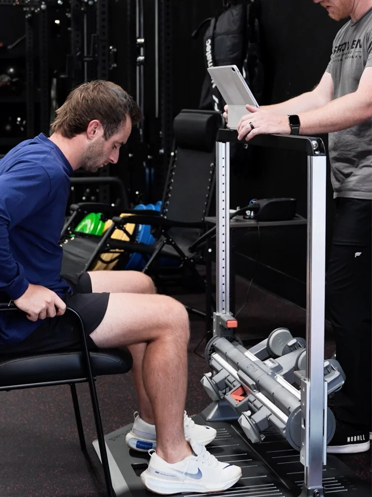 Clinician running VALD strength testing with an athlete