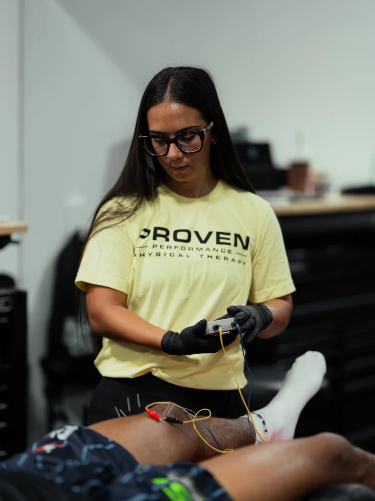 Clinician preparing dry needling treatment