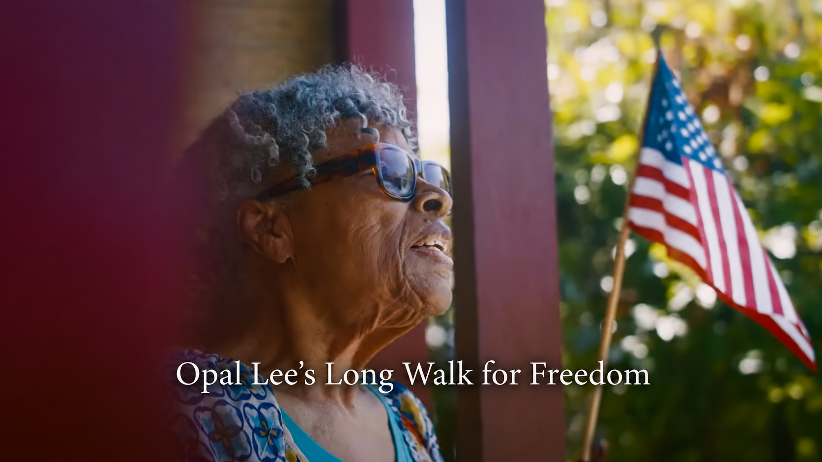 Opal Lee outdoors beside an American flag in Opal Lee’s Long Walk for Freedom