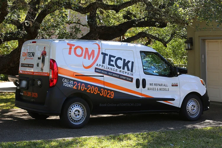 Tomtecki Appliance Repair van parked under an oak tree in a San Antonio neighborhood