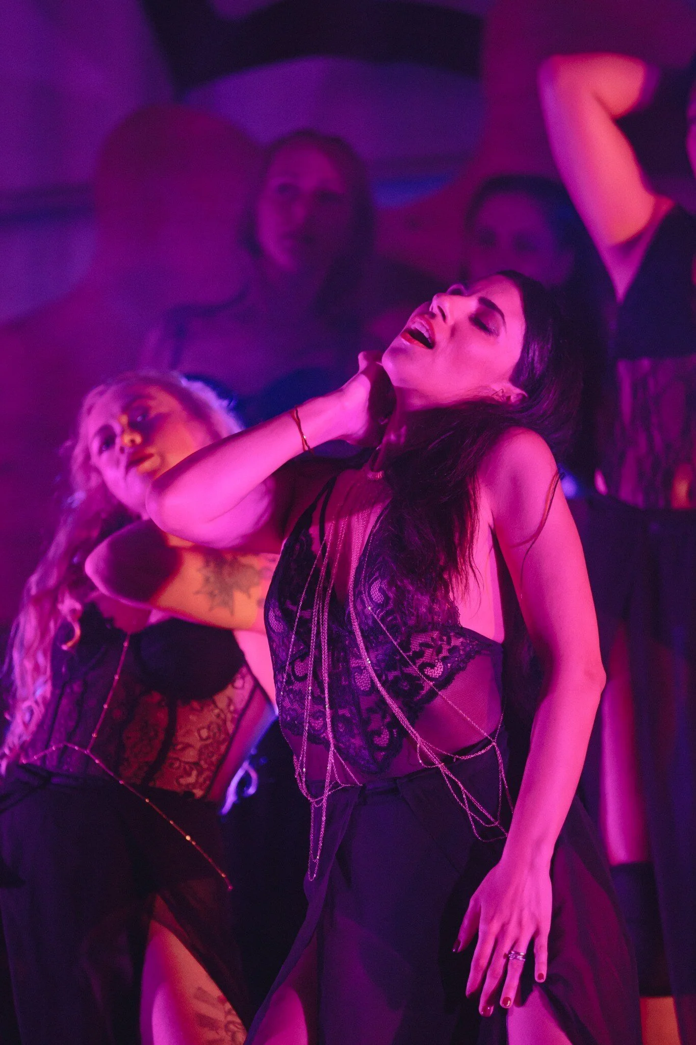 A performer embodying sensual expression at Roots Festival