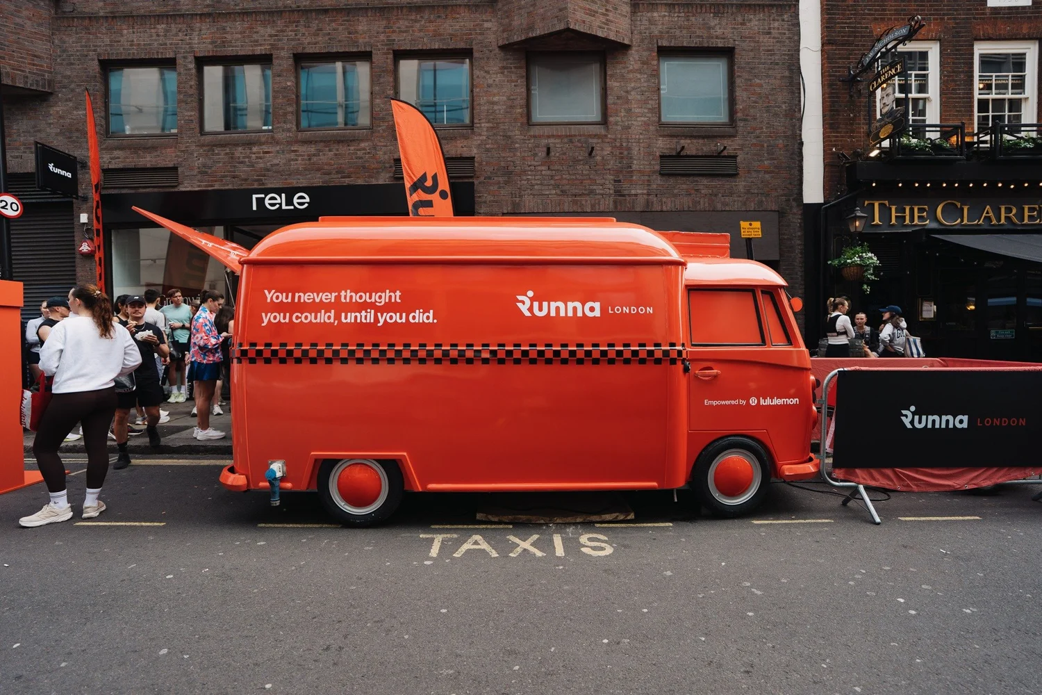 Orange Runna x lululemon truck beside the event queue