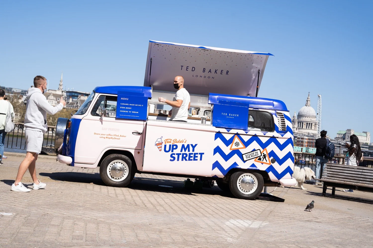 Blue and white Ted Baker Up My Street truck beside the river in London