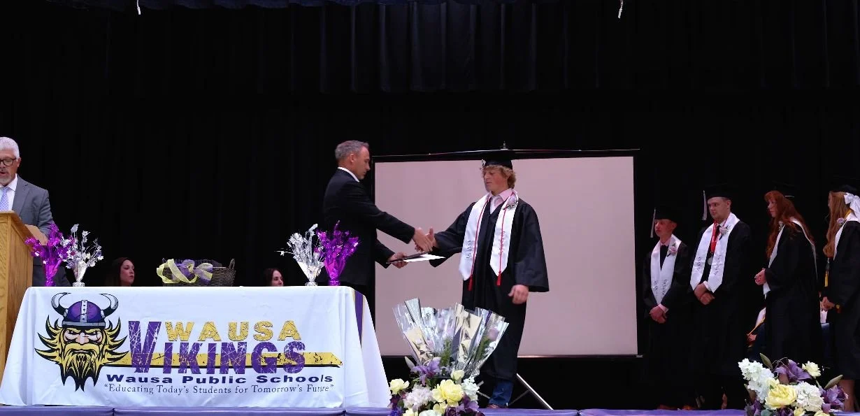 Diploma presentation at Wausa Public Schools graduation in Nebraska