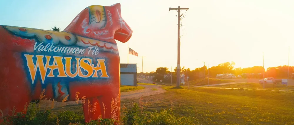 Wausa welcome horse at sunset, a still from It Takes a Village