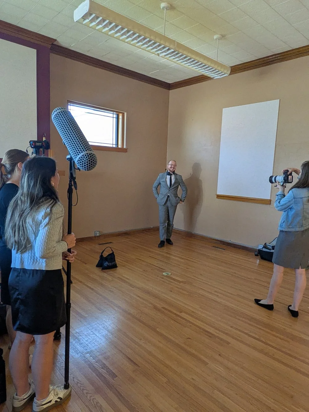 Team members practicing interview lighting and camera positions.