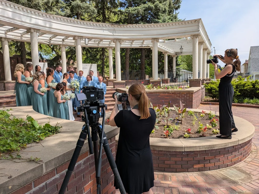 Fox Brush Films photographers and a filmmaker working together during Grace and Alex’s wedding-party portraits.