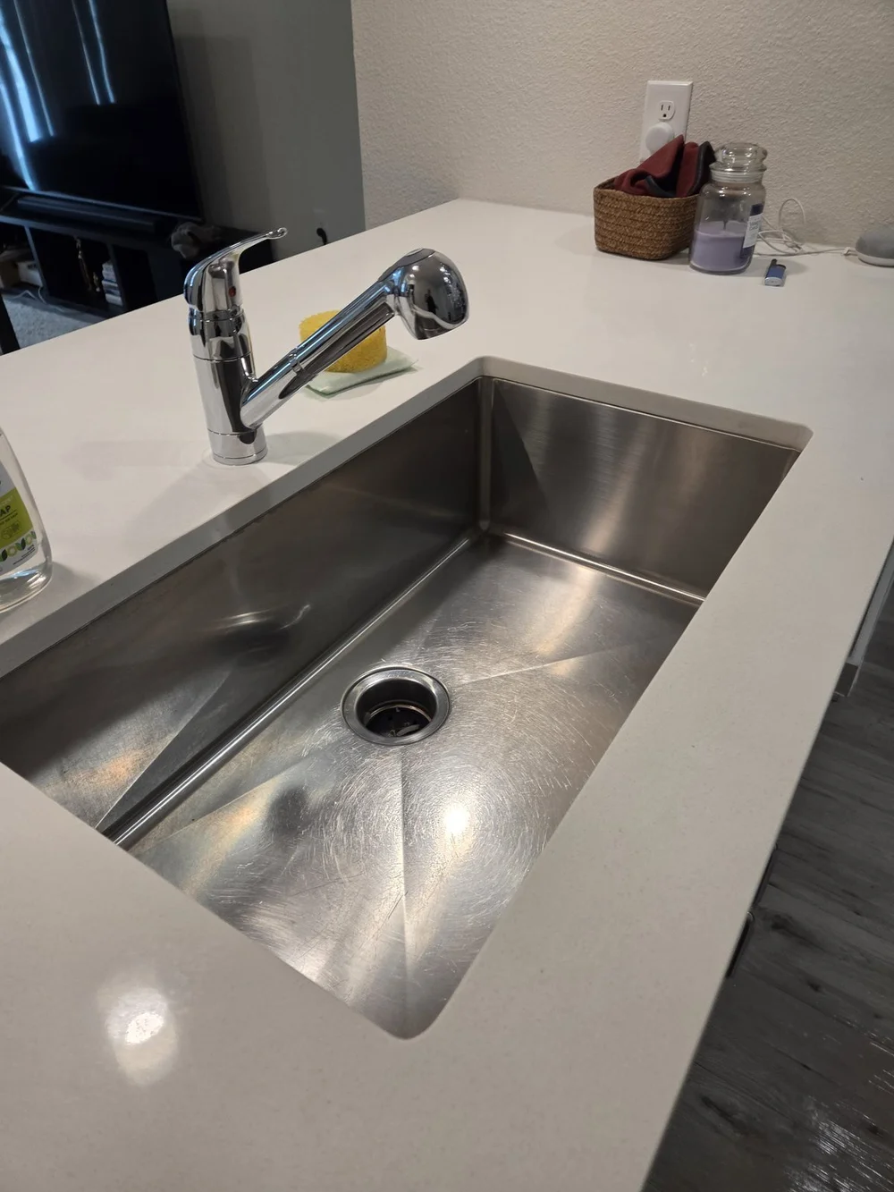 After: polished stainless steel kitchen sink in an Austin home cleaned by Sparkly Maid Austin