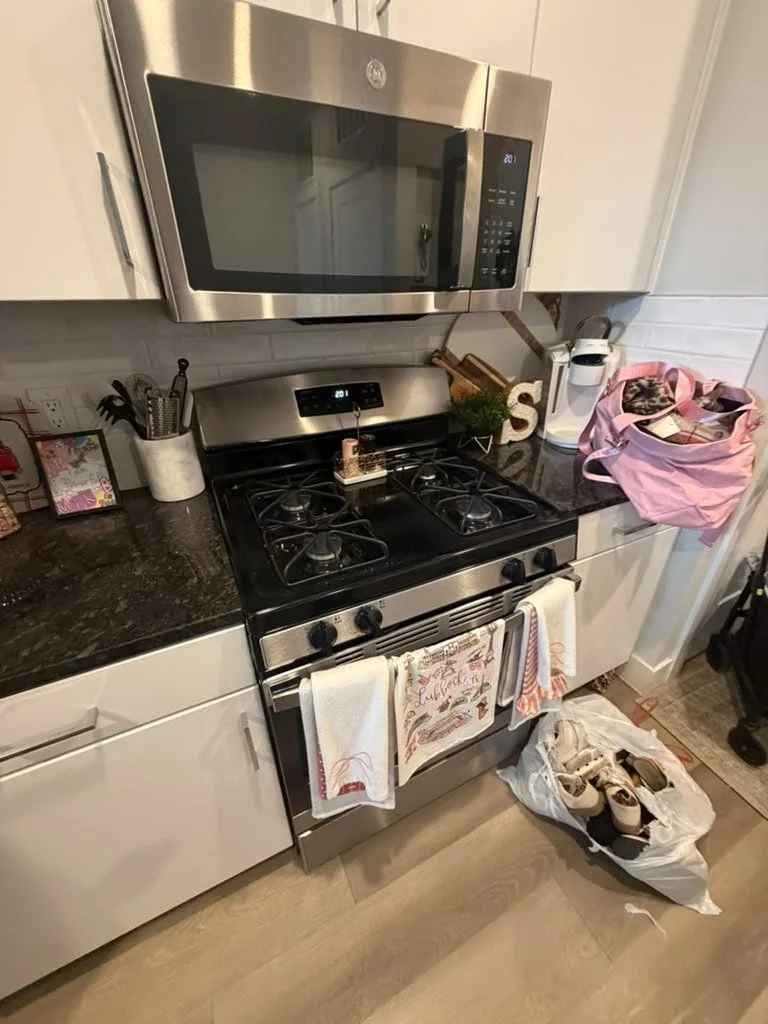 Before: greasy gas range and cluttered counters in an Austin kitchen