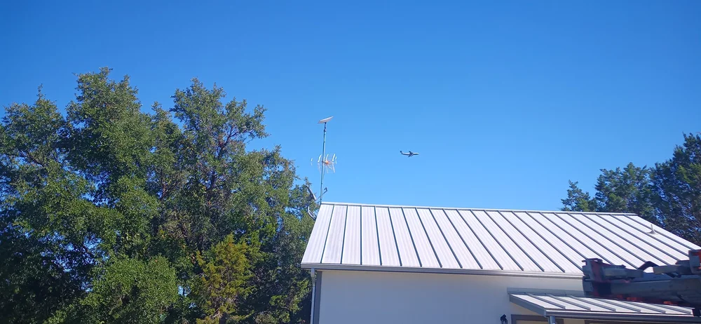 Starlink dish and Televes TV antenna on an eave mount in Rockwall, TX