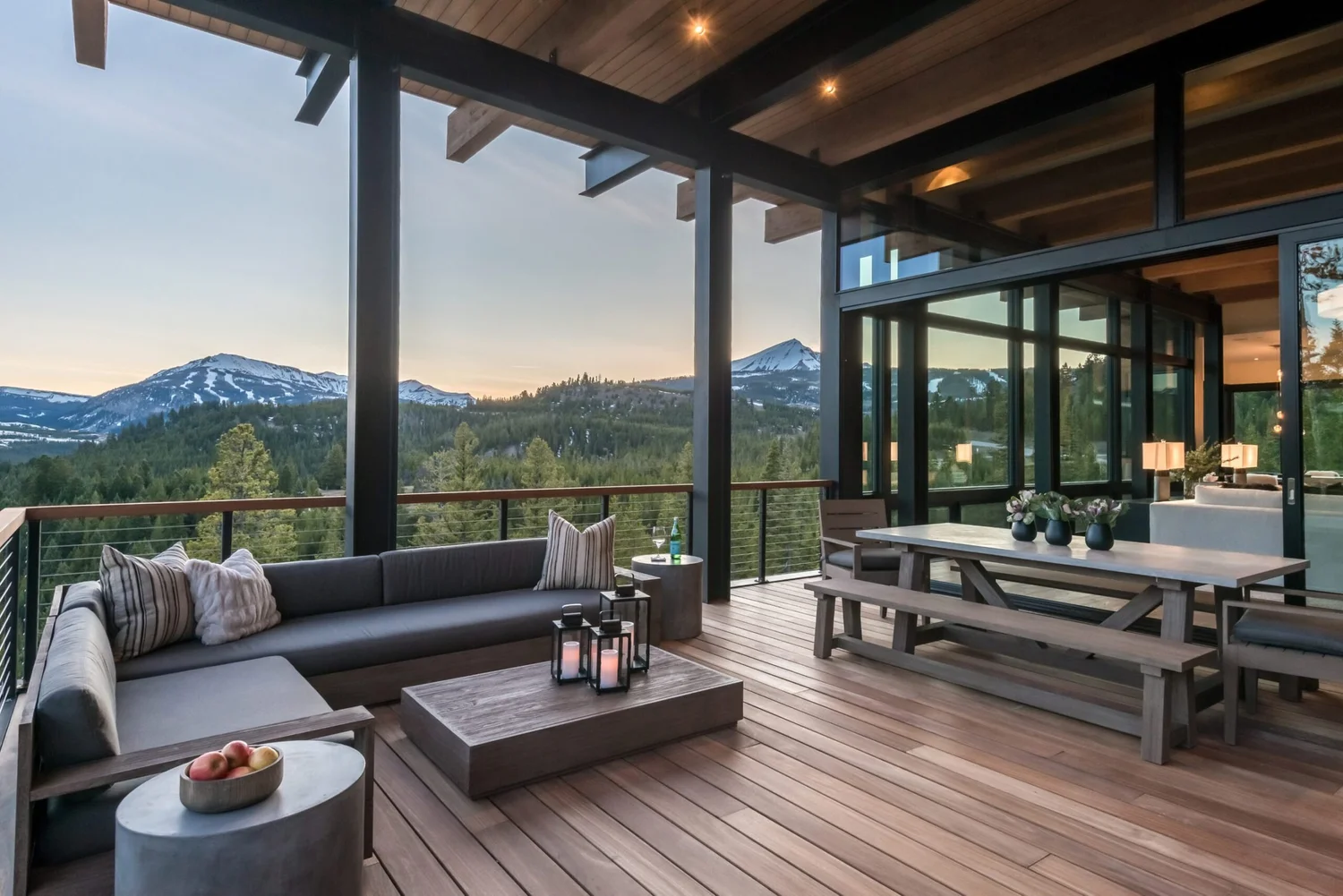 Covered deck with steel posts, beams and guard overlooking the mountains