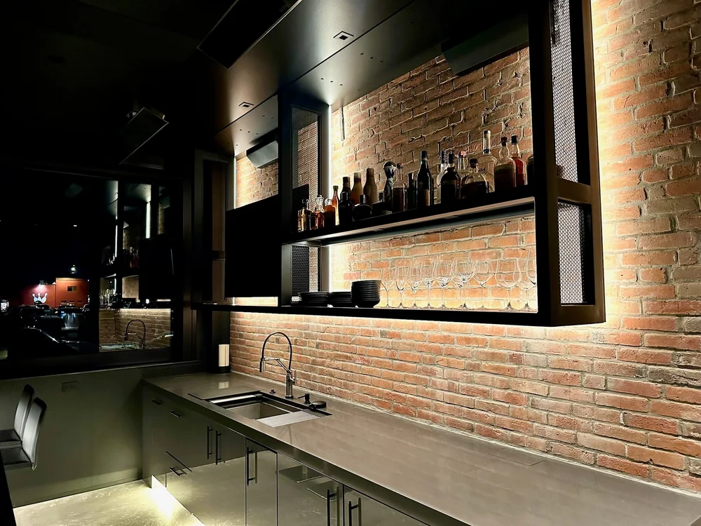 Steel back bar on brick