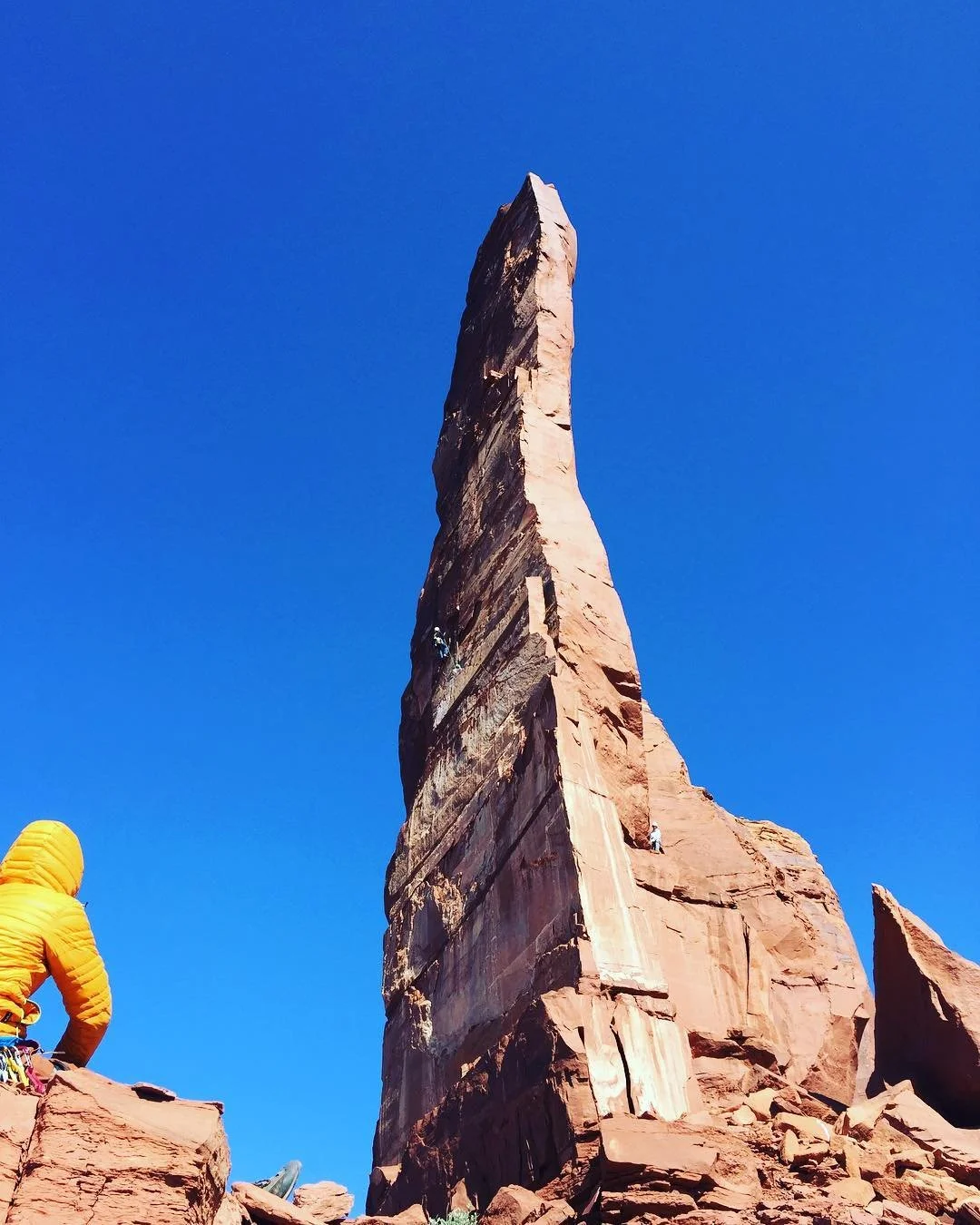 A sandstone tower near Moab beneath a clear blue sky