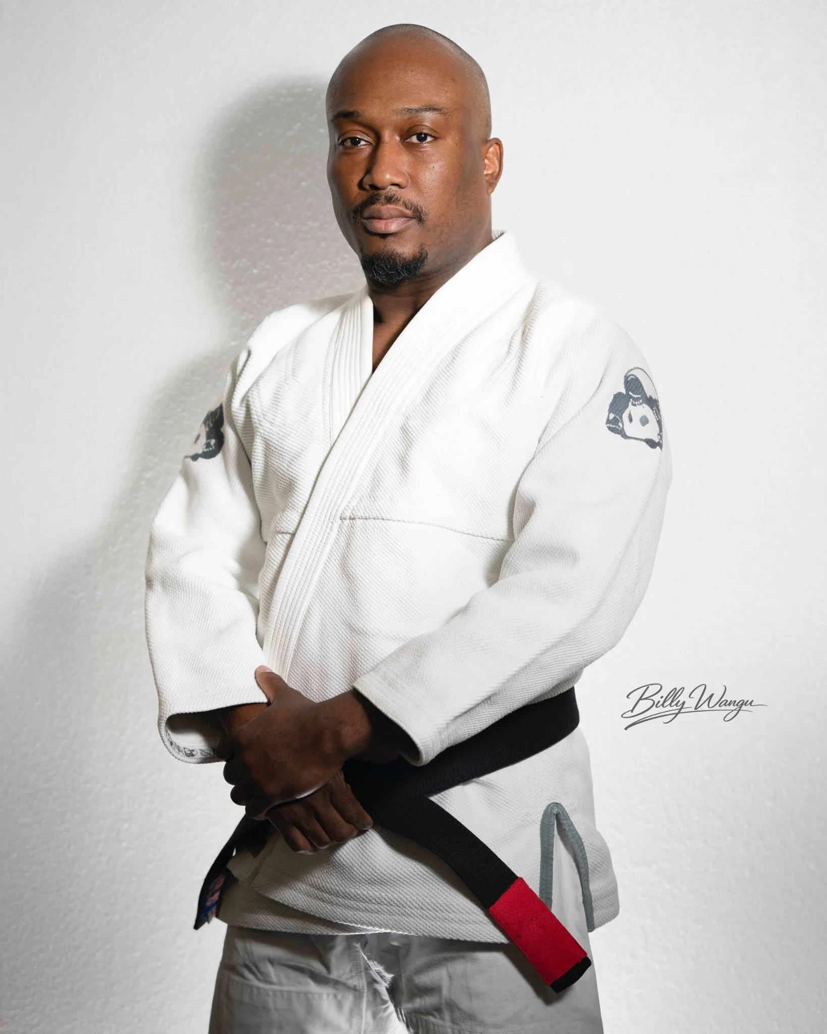 Portrait of a martial artist wearing a white gi and black belt