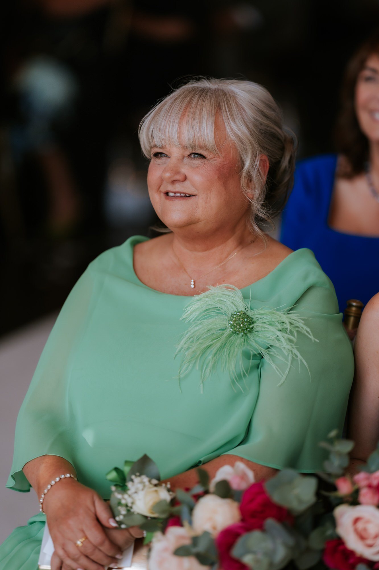Ciara’s mum watching the ceremony in her mint green dress.