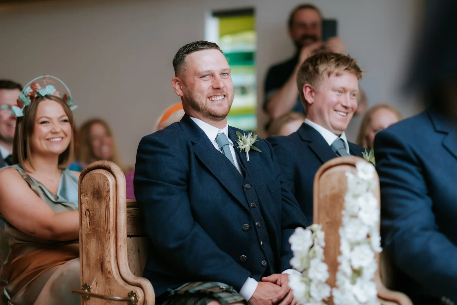 Jamie and his groomsmen laughing together during the wedding ceremony.