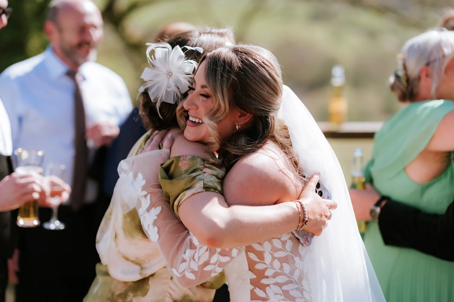Ciara greeting a guest with a hug on the decking.