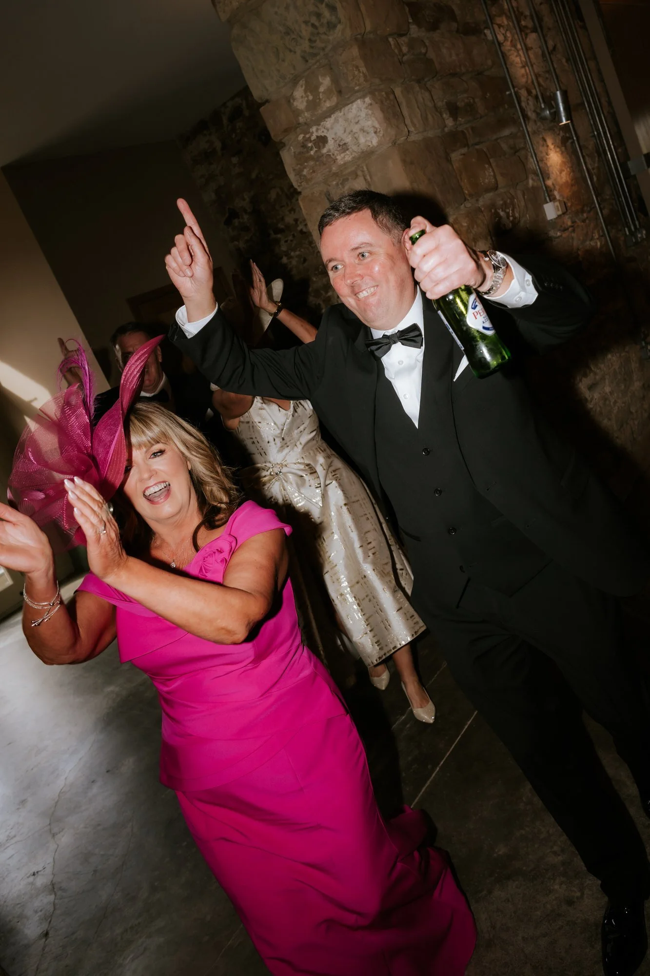 Wedding guests celebrating their entrance to the reception