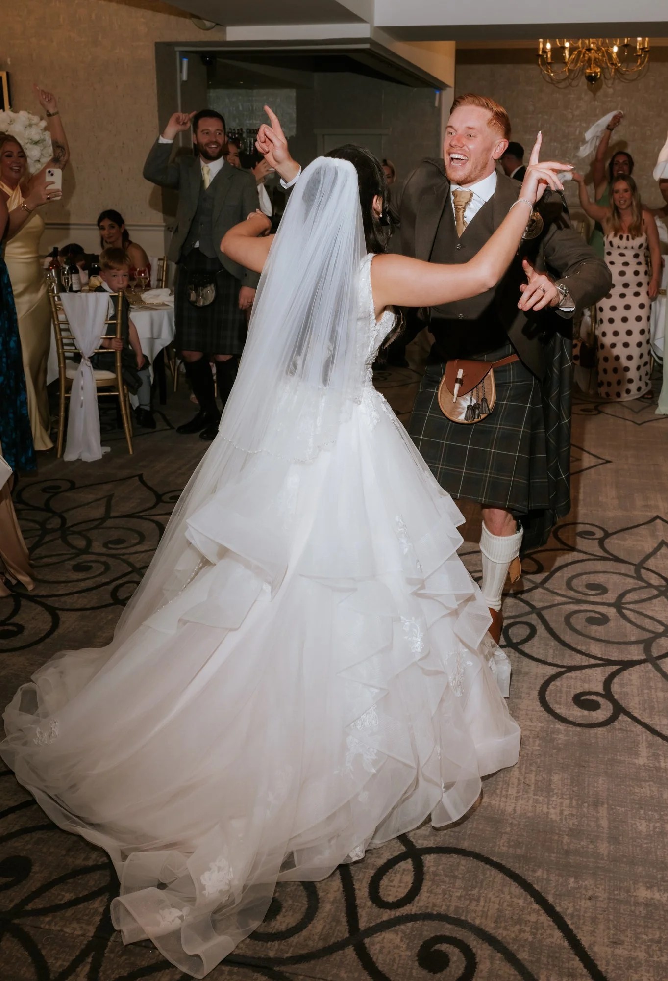 Kaitlyn and Scott dancing together during their reception entrance at Glenbervie House.