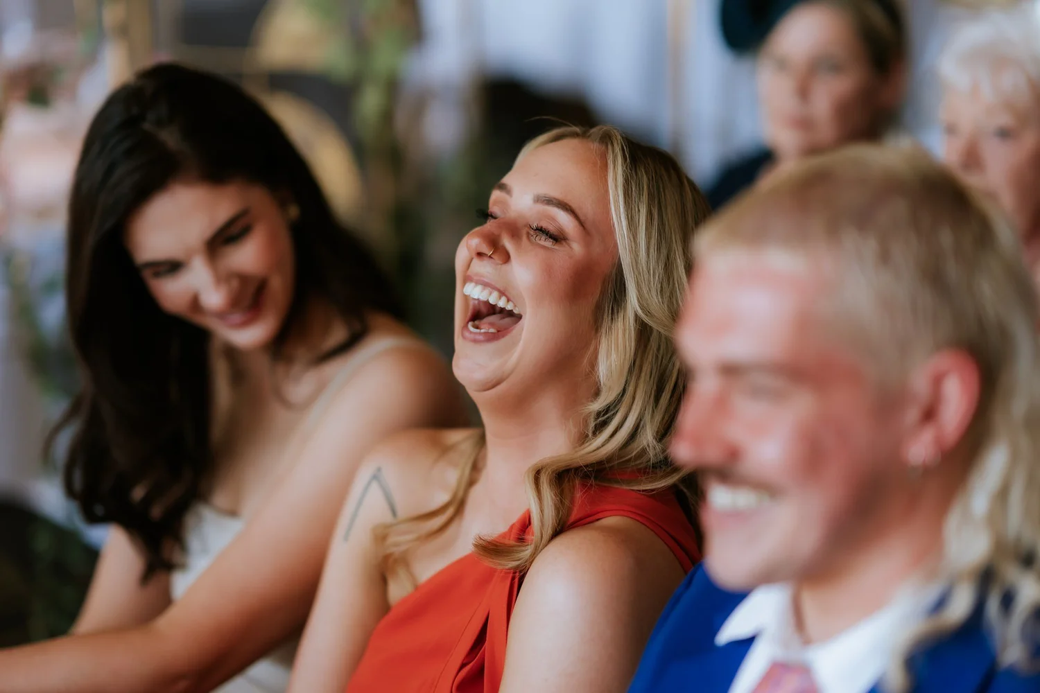 Guests sharing a big laugh during the ceremony.