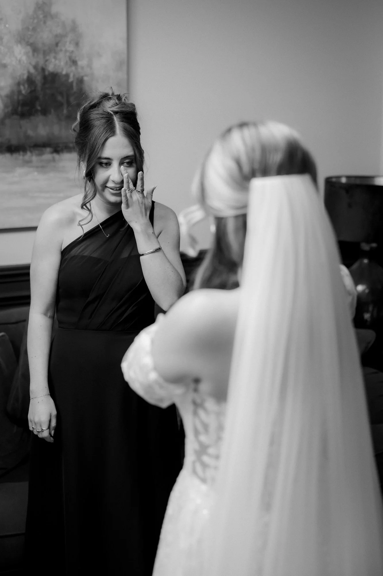 A bridesmaid wiping away a tear during Ciara’s reveal.